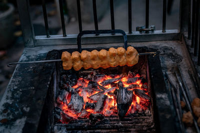 Close-up of meat on barbecue grill