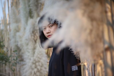 Portrait of woman standing in snow