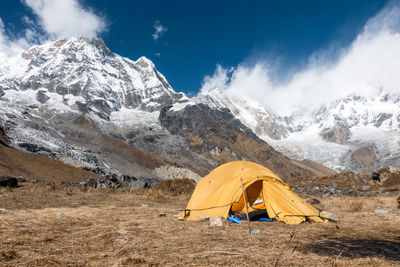 Tent against mountains