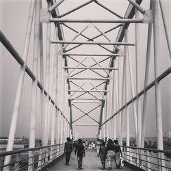 People walking on bridge