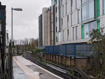 Train station in town against sky