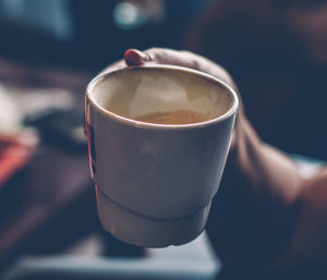 Female hand with coffee mug