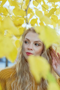 Portrait of young woman with yellow eyes