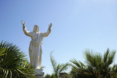 Low angle view of statue against sky