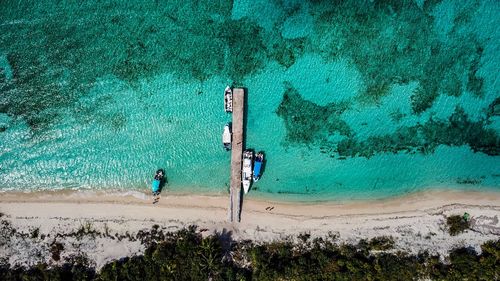 Aerial view of boats moored at beach