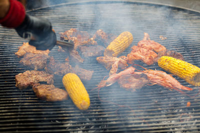 Cropped hand of man preparing food