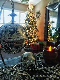 Close-up of illuminated christmas tree on table