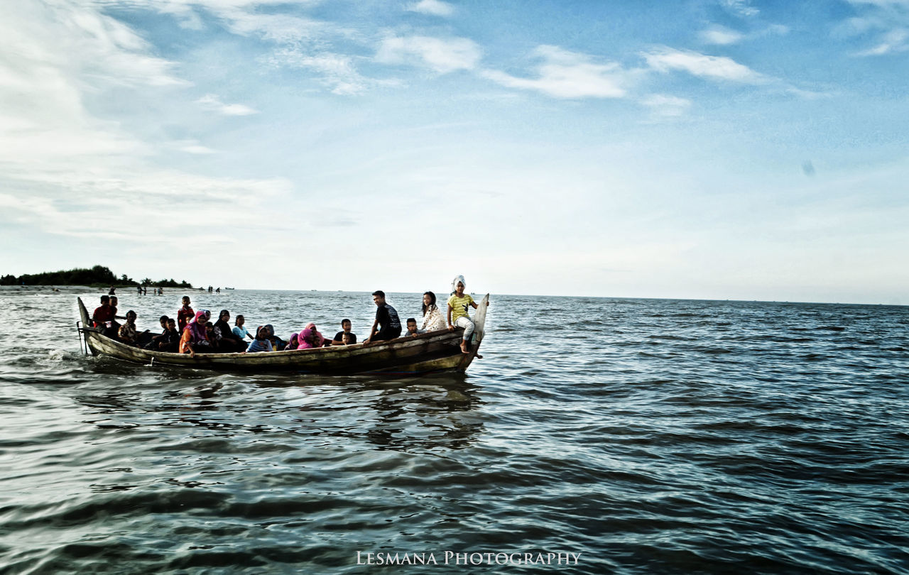 sea, sky, transportation, nautical vessel, cloud - sky, water, medium group of people, outdoors, men, waterfront, nature, real people, day, horizon over water, mode of transport, women, beauty in nature, scenics, sitting, rowing, adult, people