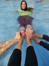 Low section of woman in swimming pool