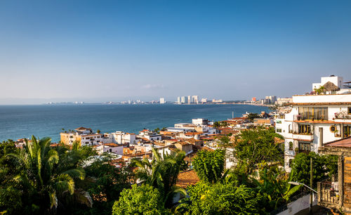 Scenic view of sea against clear blue sky