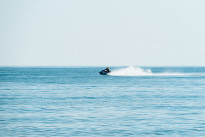 Person on a skijet against clear sky