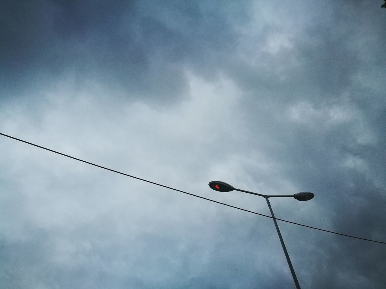 LOW ANGLE VIEW OF STREET LIGHTS AGAINST SKY
