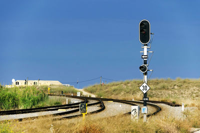 Railway tracks along countryside landscape