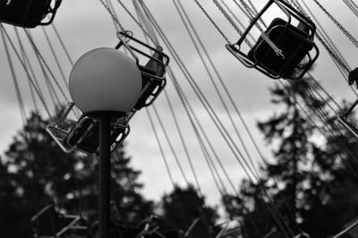 Low angle view of ferris wheel against sky