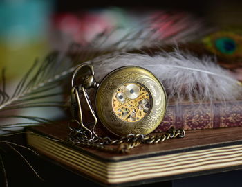 Close-up of vintage clock on table 