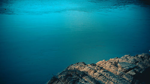 High angle view of rock formation in sea