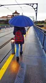 Full length of woman walking on road