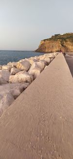 Scenic view of beach against clear sky