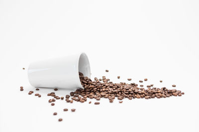 Close-up of coffee beans against white background