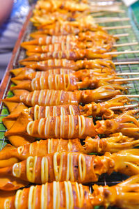 Grilled squid for sale in market