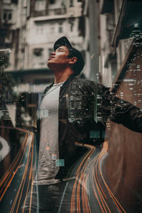 Man standing on street in city