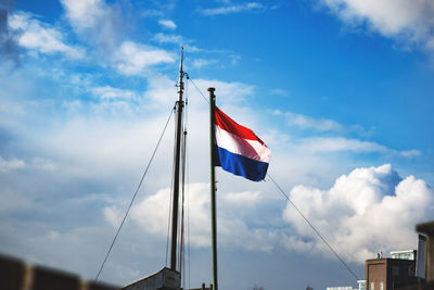 Low angle view of flag against sky