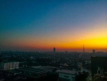 High angle view of buildings against sky during sunset