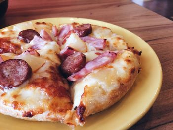 Close-up of pizza served on table