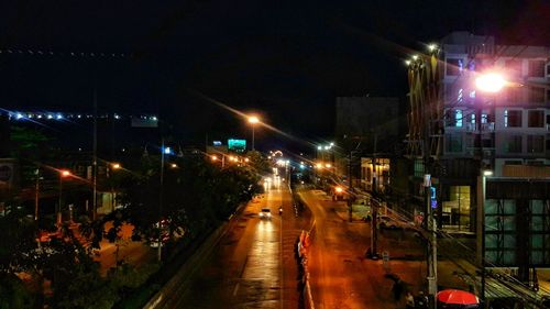 High angle view of illuminated street at night