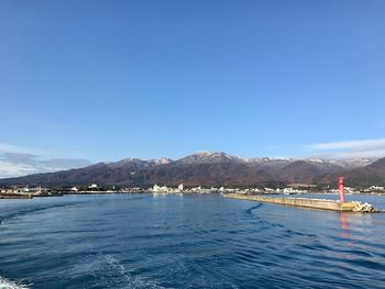 Scenic view of sea against clear blue sky