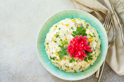 High angle view of flowering plant in plate on table