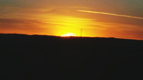 Scenic view of silhouette landscape at sunset