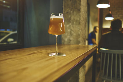 Elegant glass of craft beer and taps. beer taps in a row in perspective. selective focus.