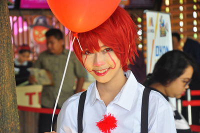 Portrait of boy with balloons