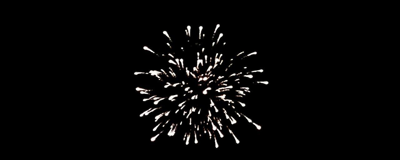 CLOSE-UP OF FIREWORKS AGAINST BLACK BACKGROUND