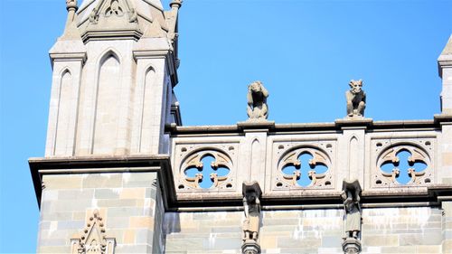 Low angle view of building against blue sky