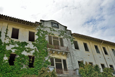 Exterior of built structure against cloudy sky