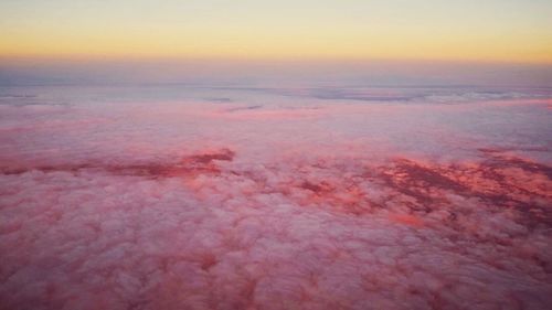 Aerial view of landscape against dramatic sky