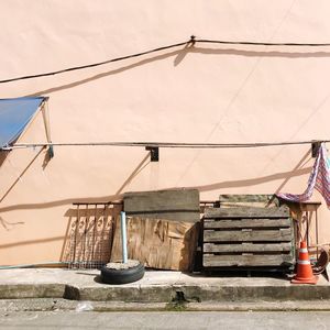 Objects against wall of building