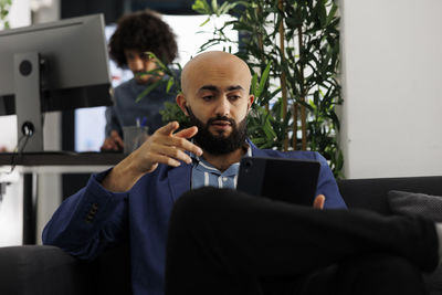 Young man using laptop at home