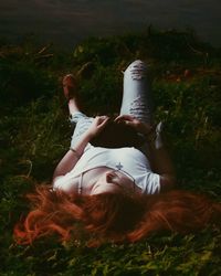 Woman lying on grass