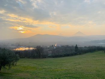 Scenic view of landscape against sky during sunset