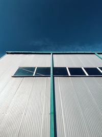 Low angle view of building against blue sky