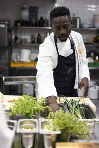 Chef cooking in kitchen of restaurant