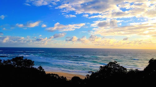 Scenic view of sea against cloudy sky