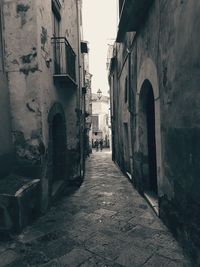 Narrow alley amidst buildings in city