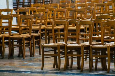 Empty chairs and tables at seaside