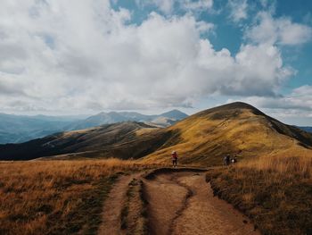 Scenic view of mountain road against sky