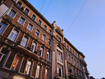 Low angle view of building against clear blue sky