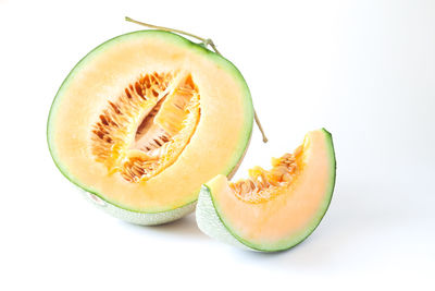 Close-up of lemon slice against white background